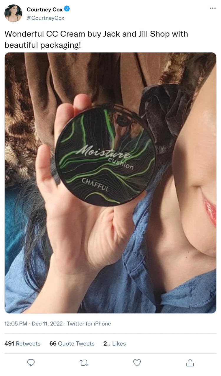 Person holding a compact labeled 'Moisture Cushion CHAFFUL.'